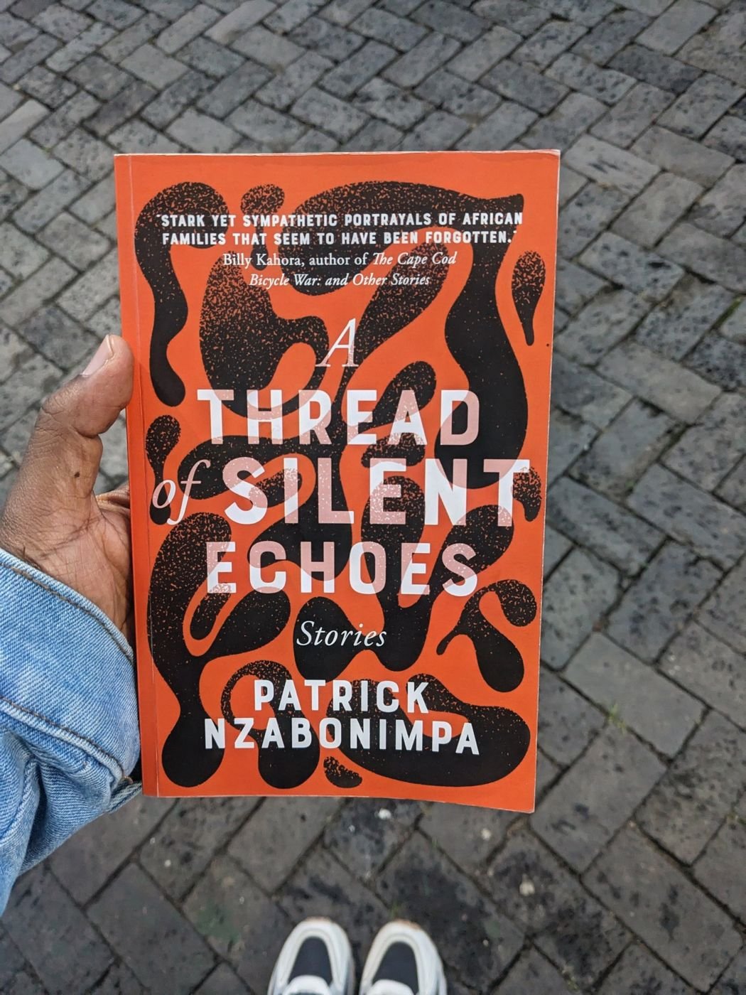 The book held up on a brick street